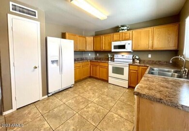 Kitchen with refrigerator