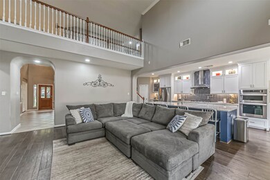 Heading past the foyer, you will find the HEART of this home- the open concept living room and kitchen.