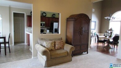 Pass through to kitchen opens the rooms.