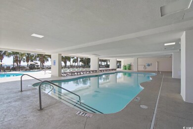 Indoor pool featuring a patio area
