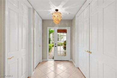 Entryway featuring a chandelier and tile patterned floors