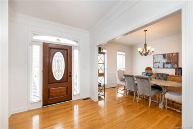 Lovely hardwoods and heavy molding run through the foyer, dining and office spaces. New door hardware compliments the beautiful finishes.