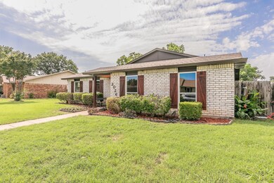 Ranch-style house with a front lawn