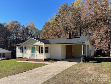 Charming Ranch Home with single carport for convenient parking and safety 