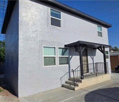 Front of property featuring stucco siding