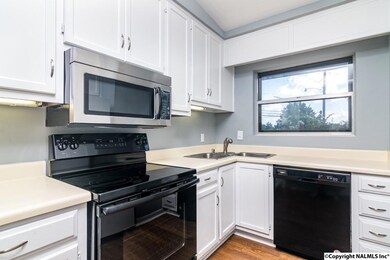 Plenty of cabinetry and natural light in the kitchen.