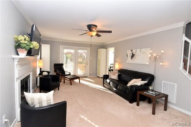 The large, bright family room features a wood-burn
