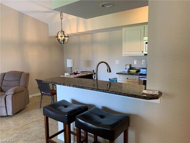 Kitchen with light tile patterned flooring, an inv