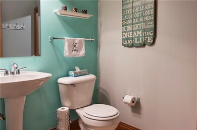 First floor powder room, leads into the laundry ro