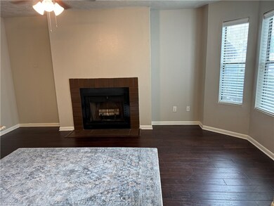 Unfurnished living room with dark wood-type floori