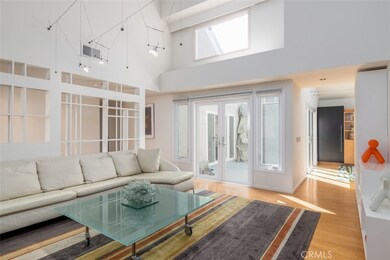 Living room with double-door to private atrium.
