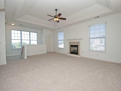 Living Room. Notice the 3 large windows 