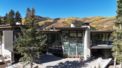 View of front of home with a mountain view and a chimney