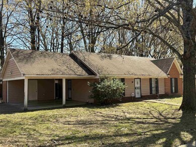Single story home featuring an attached carport, b