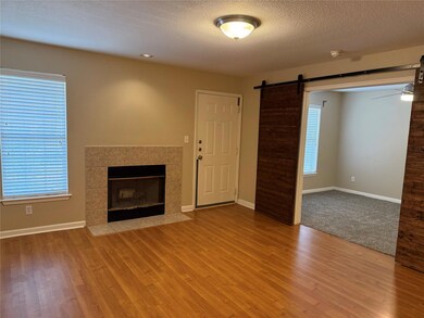 Unfurnished living room featuring a fireplace, a 