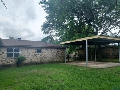 View of yard featuring a carport
