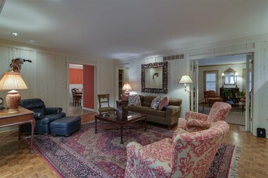 This view of den from the sunroom shows that it is