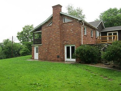 Exterior Back. Side of home, doors lead into famil