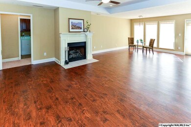 Attractive fireplace, trey ceilings and ample natural light make this space an inviting place to entertain or just relax.