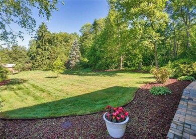 The home sits on a spacious lot with a beautiful a