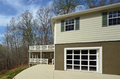 Double decks and glass roll up door from den to patio and pool.