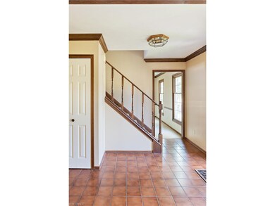The front entry way greets and boasts beautiful ti