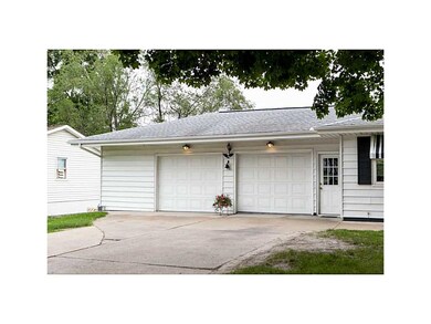 Front Exterior. Oversized, heated garage has plent