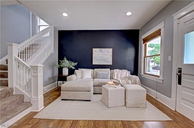 Living room with hardwood / wood-style floors