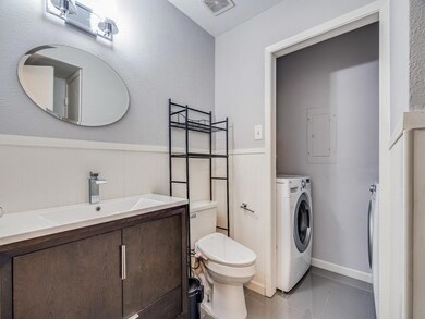 half bath downstairs with laundry facility