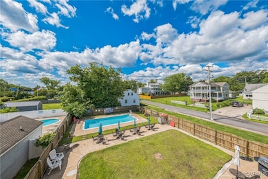 Community pool featuring a patio and a residential