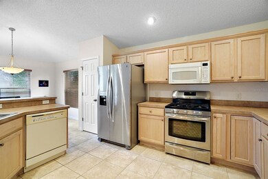kitchen with vaulted ceiling and plenty of cabinet