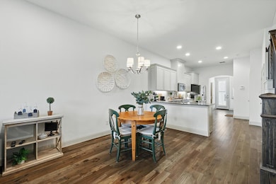 Dining room with recessed lighting, an inviting ch