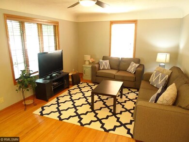 Living Room w/ bow window & coved ceiling!