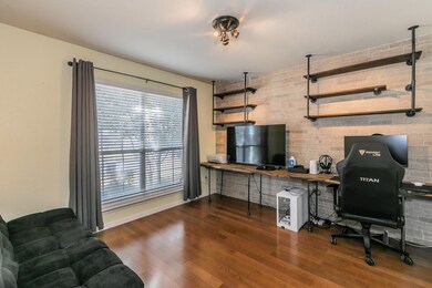 Office area with dark hardwood / wood-style floori