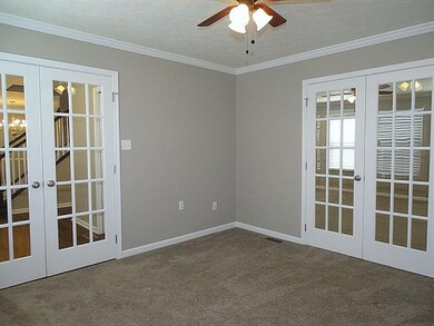 Den/Living Room with double French doors (to foyer