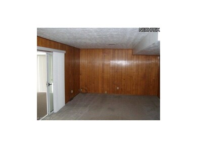 Paneled Family Room Two Steps down from Kitchen. O