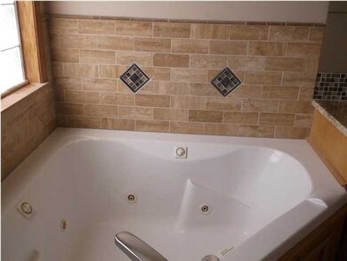master bath has whirlpool tub, private shower, wal