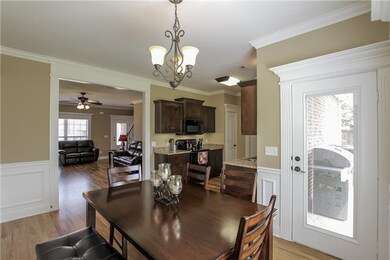 Dining Room area with door leading to cover patio.