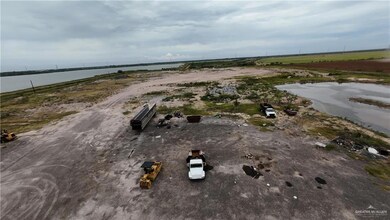 Aerial overview of property's location featuring a nearby body of water