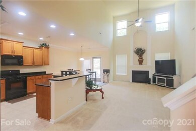 Kitchen opens up to dining area and 2-story great 