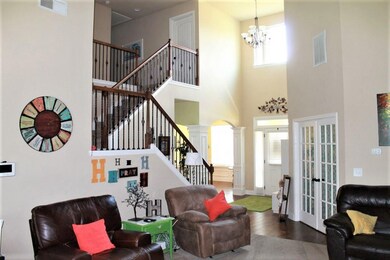 Front entry view with open staircase