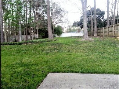 Beautiful private fenced yard with mature trees