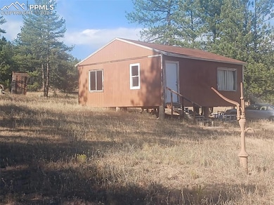 View of property exterior, hand pump in view