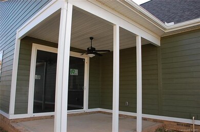 Screened in covered porch on side of house