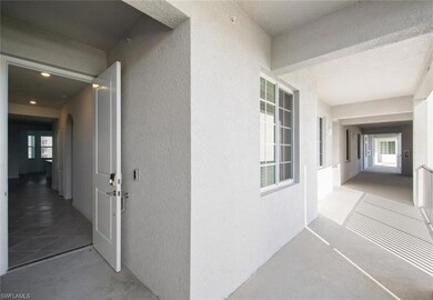 View of exterior entry featuring stucco siding