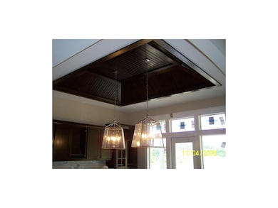 Beautiful wood trim coffered ceiling over eat in k