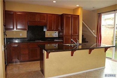 Kitchen with granite counter tops and stainless st