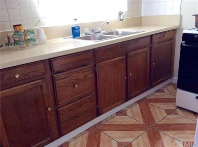 Ceramic Tile Kitchen floor, re-finished Oak cabine
