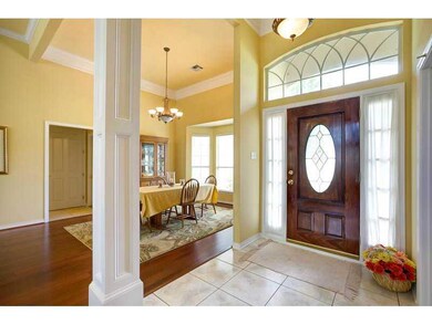 Foyer. Wide columned entry with lots of natural li