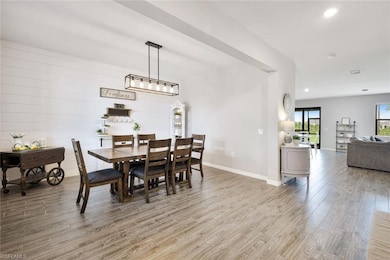 Dining space with wood-type flooring